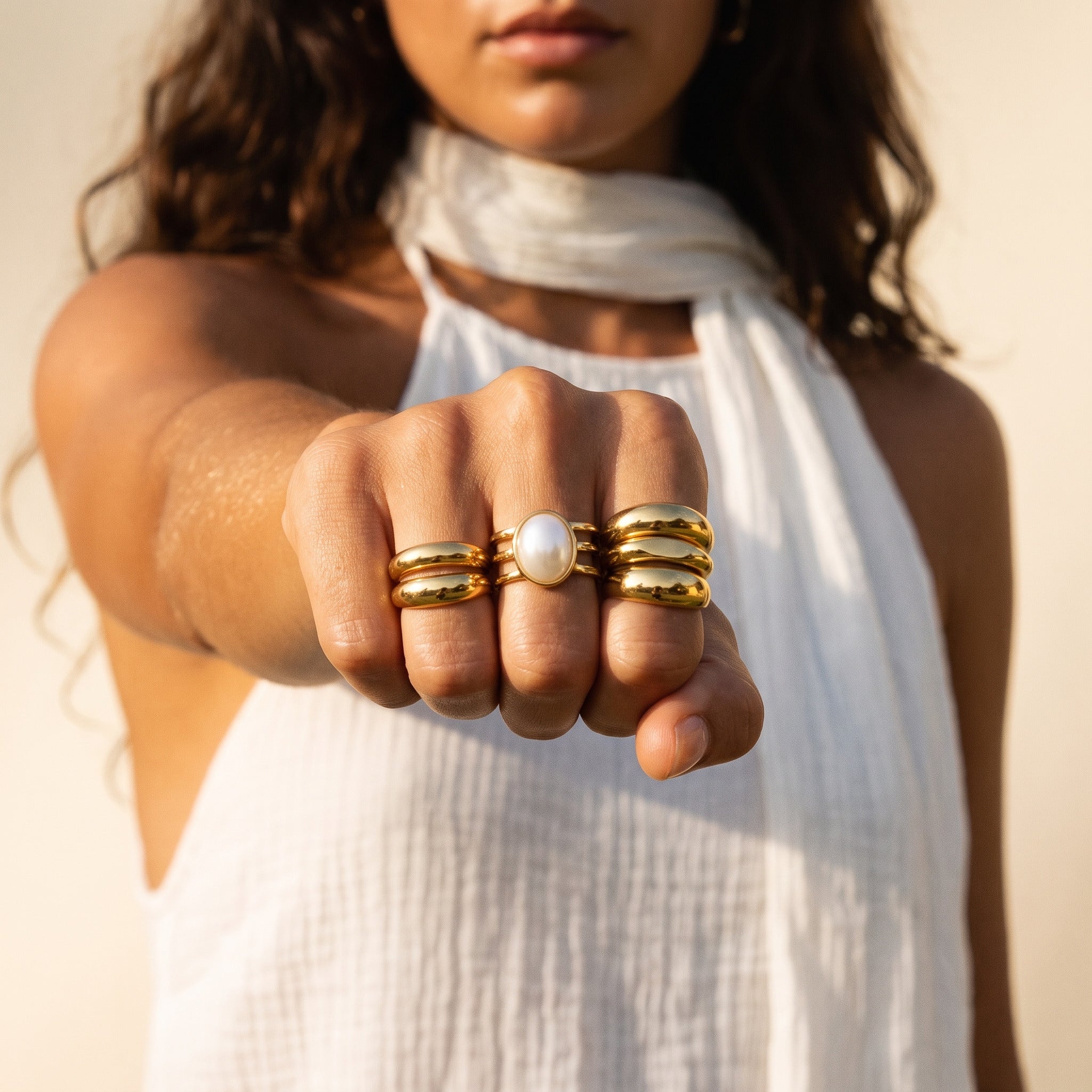 Gold statement rings stacked on a hand — Glam by Layal